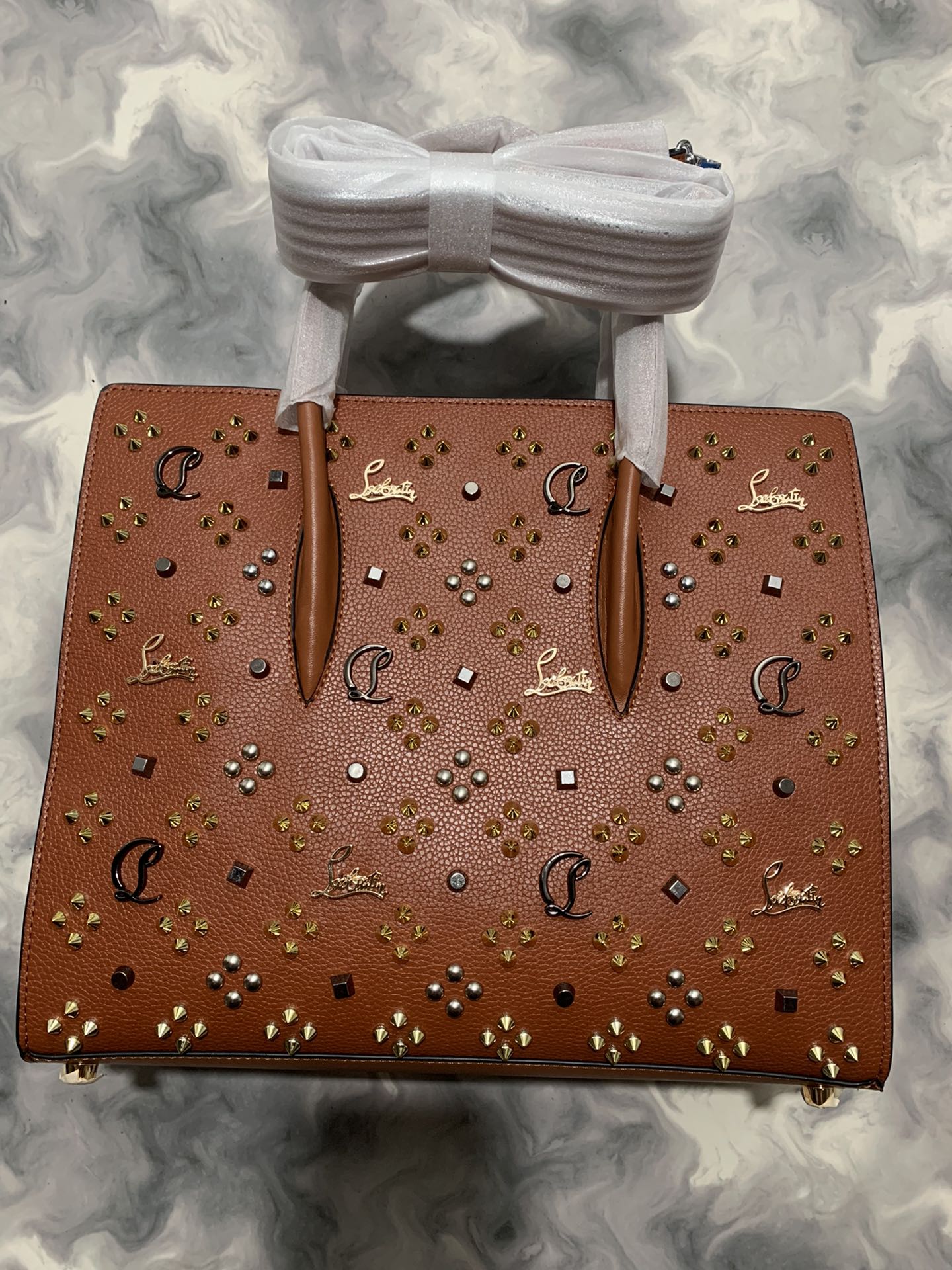 Christi** Loubout** red handbag