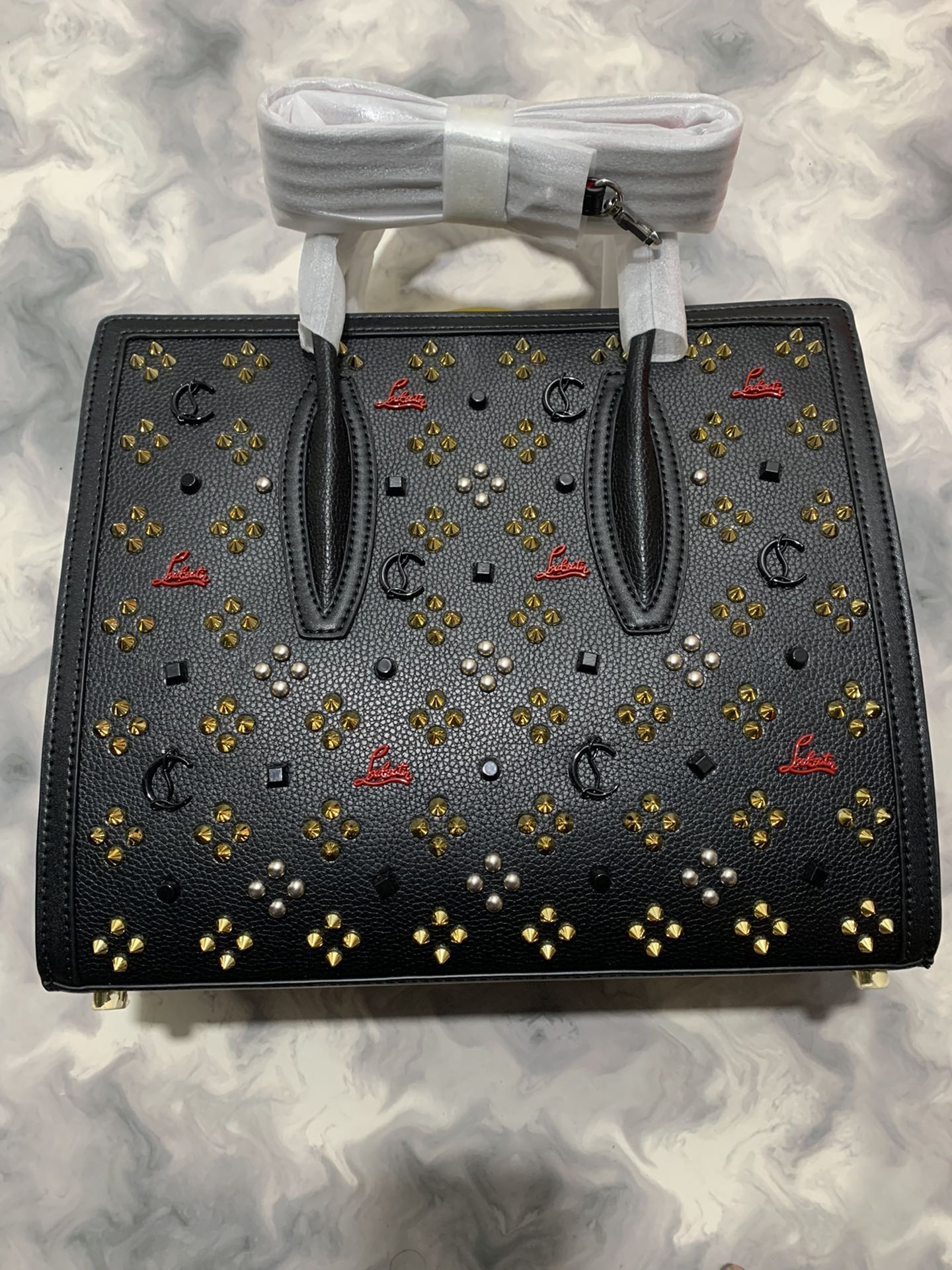 Christi** Loubout** red handbag